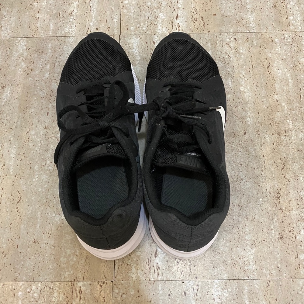 Kids Black and White Nike sneakers